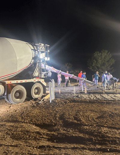 image of cement truck and workers