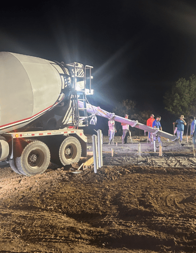 image of cement truck and workers